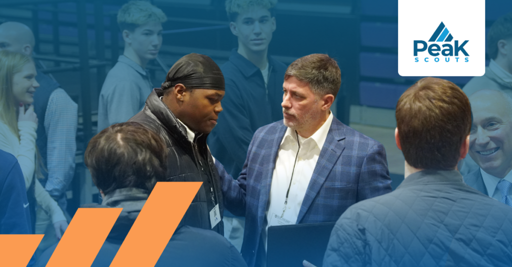Peak Scouts managing director Dave in conversation with a young sports professional at an industry event, representing the culture and fit evaluation process.